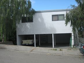 Vallejo apartment for rent - the front of a white house with a car garage