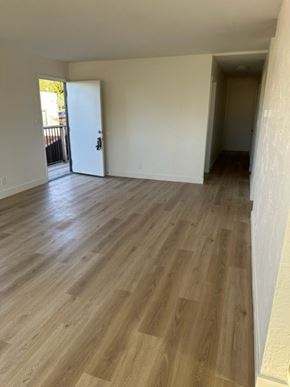 Vallejo apartment for rent - an empty living room with a wooden floor