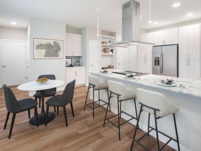 San Antonio apartment for rent - A modern kitchen with a white table and black chairs.
