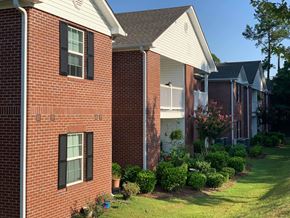 Moultrie apartment for rent - a brick house with a yard in front of it