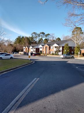 Vidalia apartment for rent - a street in a neighborhood with houses and cars