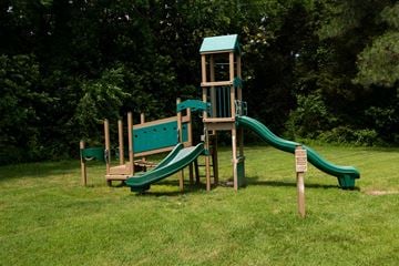 Newport News apartment for rent - A wooden playground with a green slide.