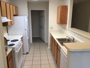 Douglas apartment for rent - a kitchen with a stove and a sink and a refrigerator