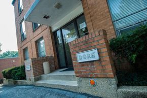 Washington apartment for rent - A red brick building with a sign that says Dore.