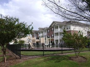 Rincon apartment for rent - an apartment building with a fence in front of it
