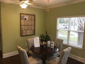 Rincon apartment for rent - a dining room with a table and chairs and a bulletin board on the wall