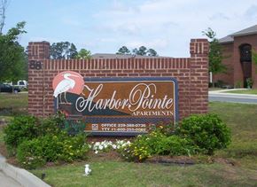 Tifton apartment for rent - a sign is on the side of a brick wall