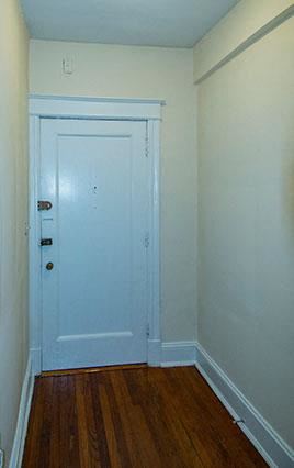 Washington apartment for rent - A white door is in a room with a wooden floor.