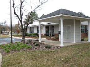 Wrightsville apartment for rent - A small house with a porch and a tree in front.