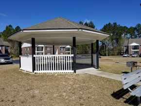 Jesup apartment for rent - a gazebo with a white fence and a picnic table