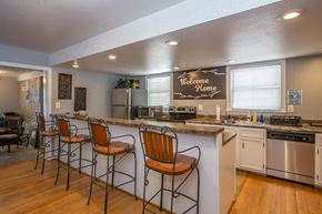 Roanoke apartment for rent - a kitchen with a bar and a counter top with chairs