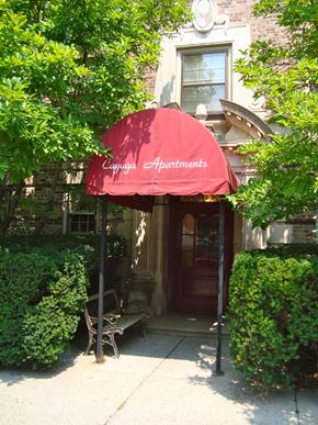 Ithaca apartment for rent - A red awning with the words Cayuga Apartments on it.