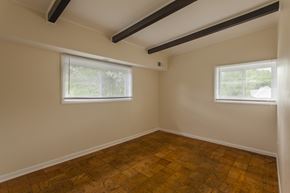 Stoughton apartment for rent - a bedroom with wood floors and two windows