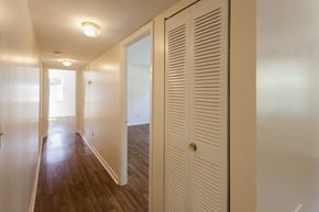 Milford apartment for rent - the view of a hallway from a bedroom with a closet and an open door