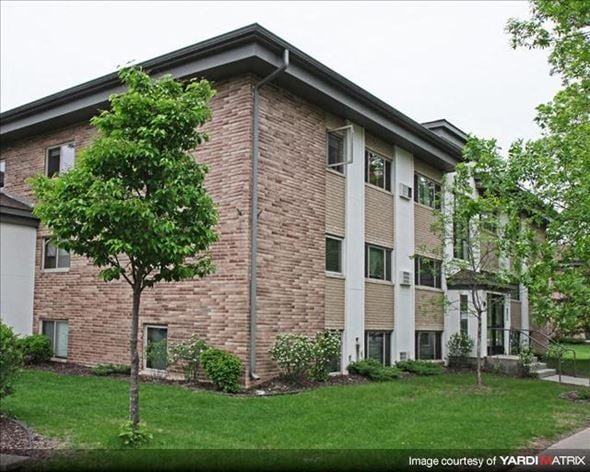 St. Paul apartment for rent - a brick apartment building with a tree in the yard