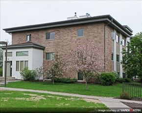 St. Paul apartment for rent - a brick building with a flowering tree in front of it