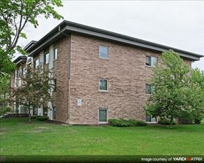 St. Paul apartment for rent - a brick building with green grass and trees