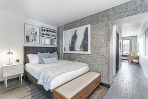 Portland apartment for rent - a bedroom with a large bed and a window