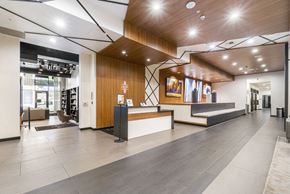 Portland apartment for rent - the lobby of a building with a reception desk and a staircase
