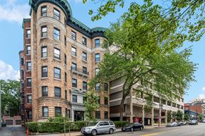 Cambridge apartment for rent - a large brick building with cars parked in front of it