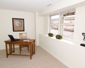 Cambridge apartment for rent - a living room with a laptop on a desk and a window