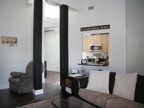 Suffolk apartment for rent - a living room with a couch and a kitchen
