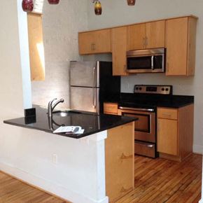 Suffolk apartment for rent - a kitchen with a black counter top and