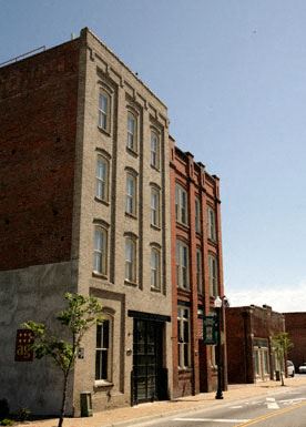 Suffolk apartment for rent - a tall brick building on the side of a street