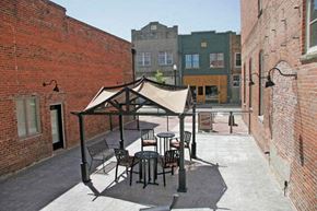 Suffolk apartment for rent - a patio with tables and chairs and a tent