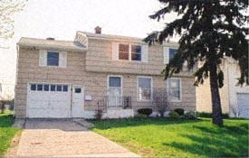Buffalo house for rent - a house with a tree in front of it
