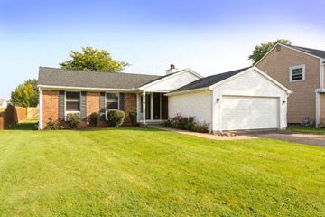 Amherst house for rent - a house with a yard and a white garage door
