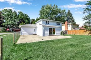 Tonawanda house for rent - a small white house with a yard and a driveway