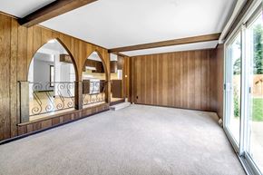 Tonawanda house for rent - a living room with a carpeted floor and a balcony