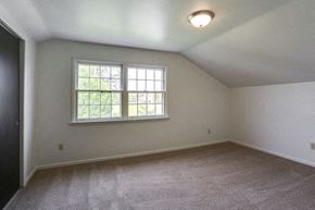 Tonawanda house for rent - A room with a window and carpeted floor.