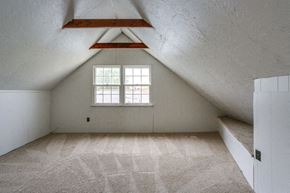 Tonawanda house for rent - A room with a window and a carpeted floor.