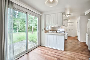 Amherst house for rent - a kitchen with a sliding glass door and a counter top