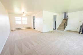 Amherst house for rent - A room with a staircase and a window.