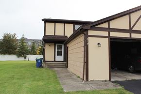 Amherst triplex for rent - the front of a garage with the door open