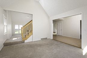 East Amherst house for rent - A room with a staircase and a doorway leading to another room.