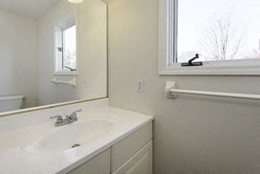 East Amherst house for rent - A bathroom with a white sink and a mirror.