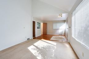 East Amherst condo for rent - A sunny day in a spacious room with a bathtub and a window with blinds.