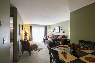 Canton townhouse for rent - a living room and dining room with a table and chairs