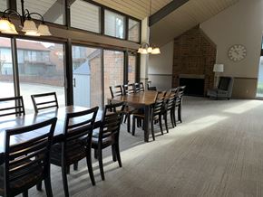 Canton townhouse for rent - a dining room with a long wooden table and chairs