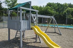 Canton apartment for rent - a playground with a slide and a swing set