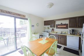 Canton apartment for rent - a kitchen with a dining table and a sliding glass door