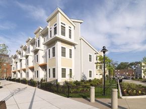 South Boston apartment for rent - a row of town homes with white siding and a sidewalk