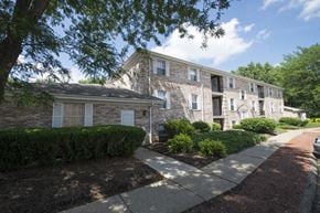 Canton apartment for rent - a brick apartment building with a sidewalk in front of it