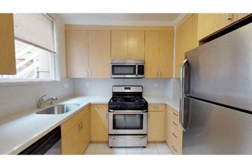San Francisco apartment for rent - a kitchen with a stove microwave and refrigerator