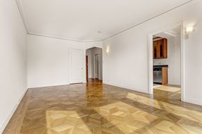 San Francisco apartment for rent - a renovated living room with a wooden floor and white walls