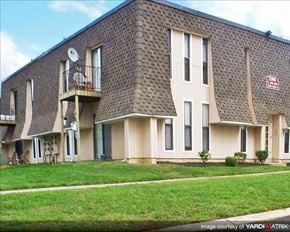 Westville apartment for rent - A building with a balcony and a satellite dish on the roof.